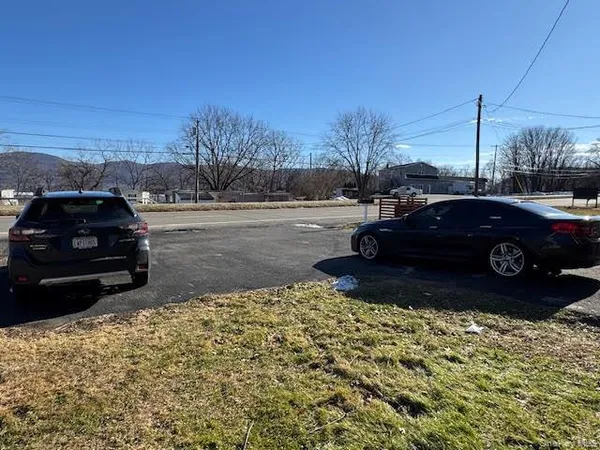 a view of a car parked on the side of the road