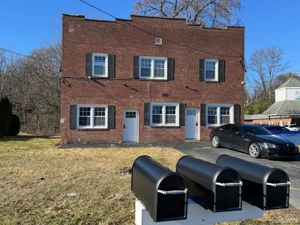 a front view of house with a yard
