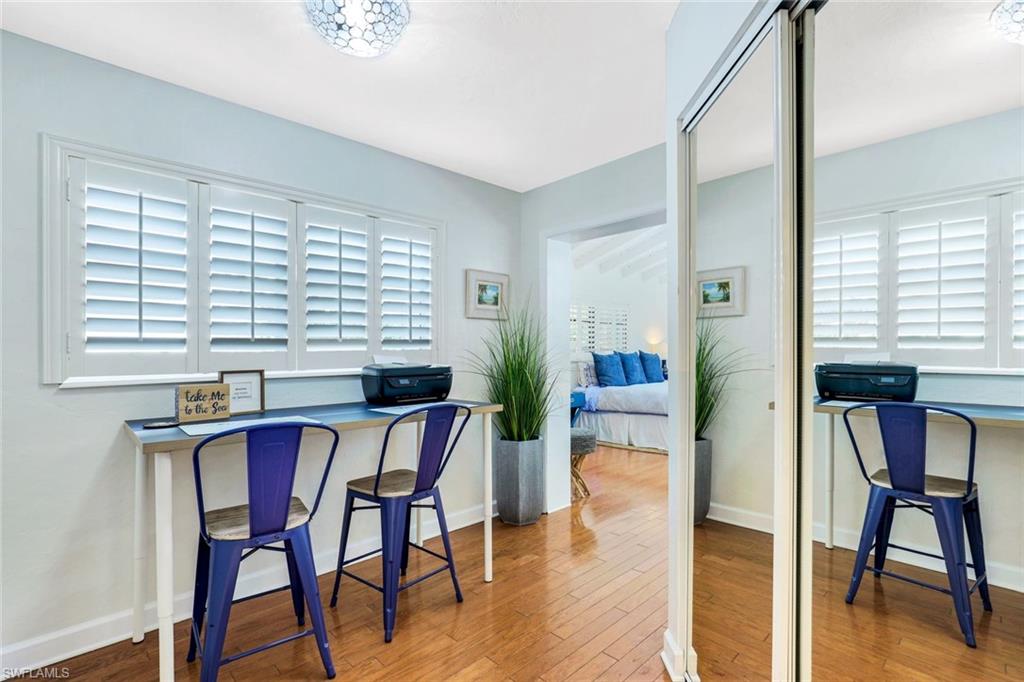 739 7th Avenue North Naples, FL 34102 - Photo 19 of 30 a view of a dining room with furniture and wooden floor