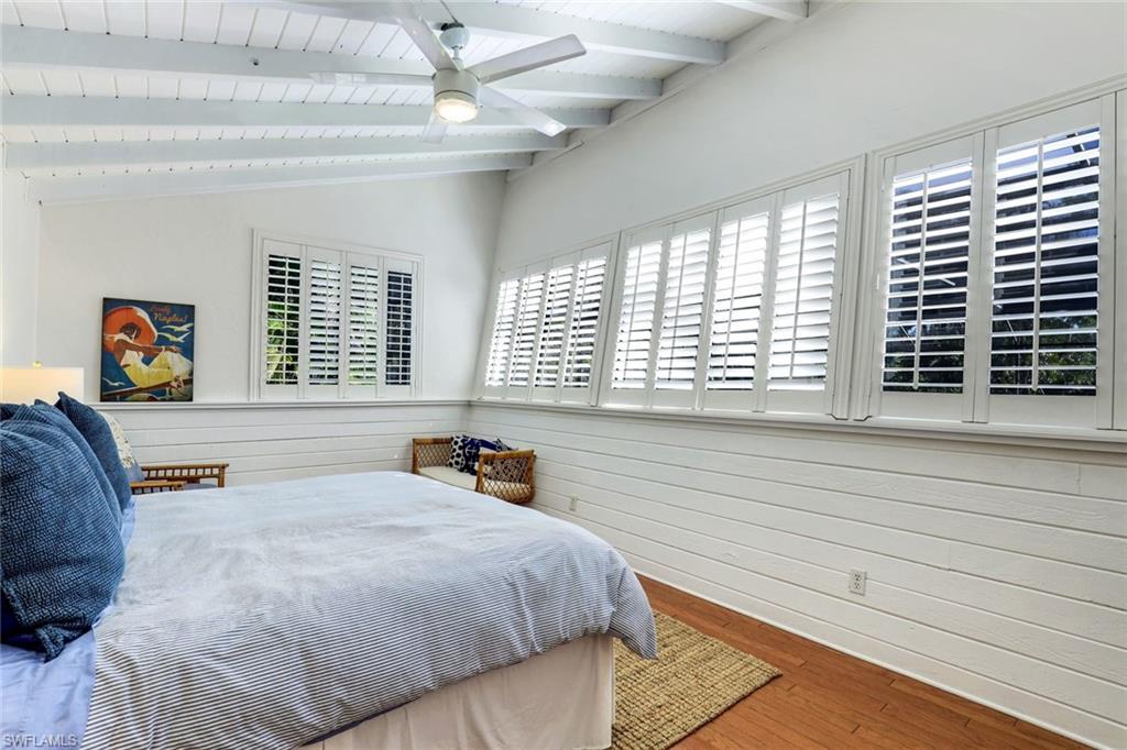 739 7th Avenue North Naples, FL 34102 - Photo 21 of 30 a bedroom with a bed and a large window