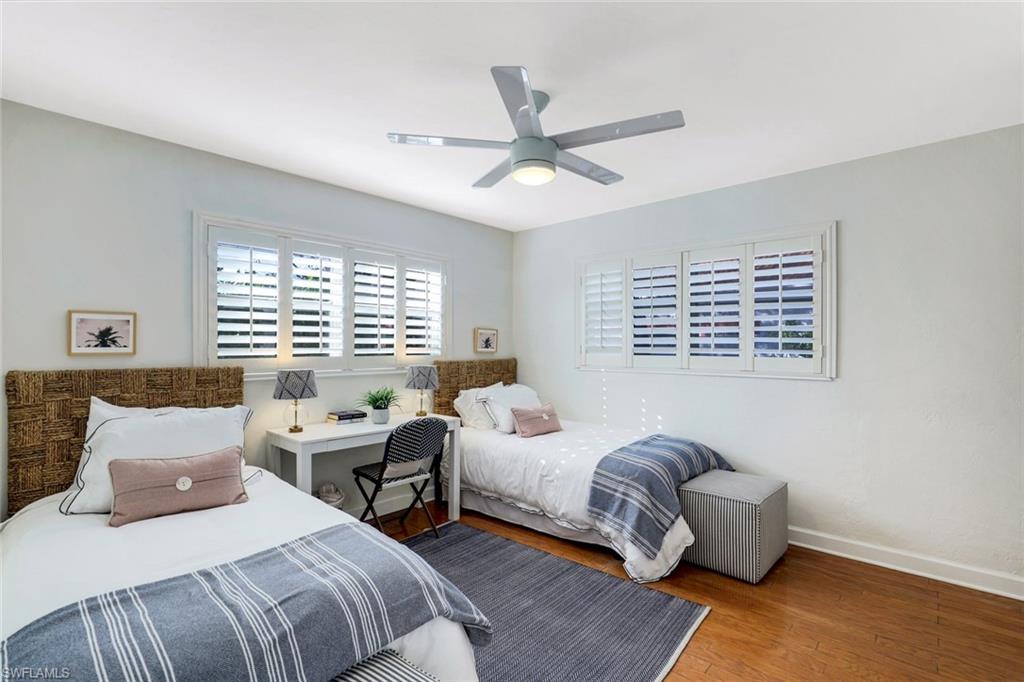 739 7th Avenue North Naples, FL 34102 - Photo 23 of 30 a bedroom with a bed couch and a window