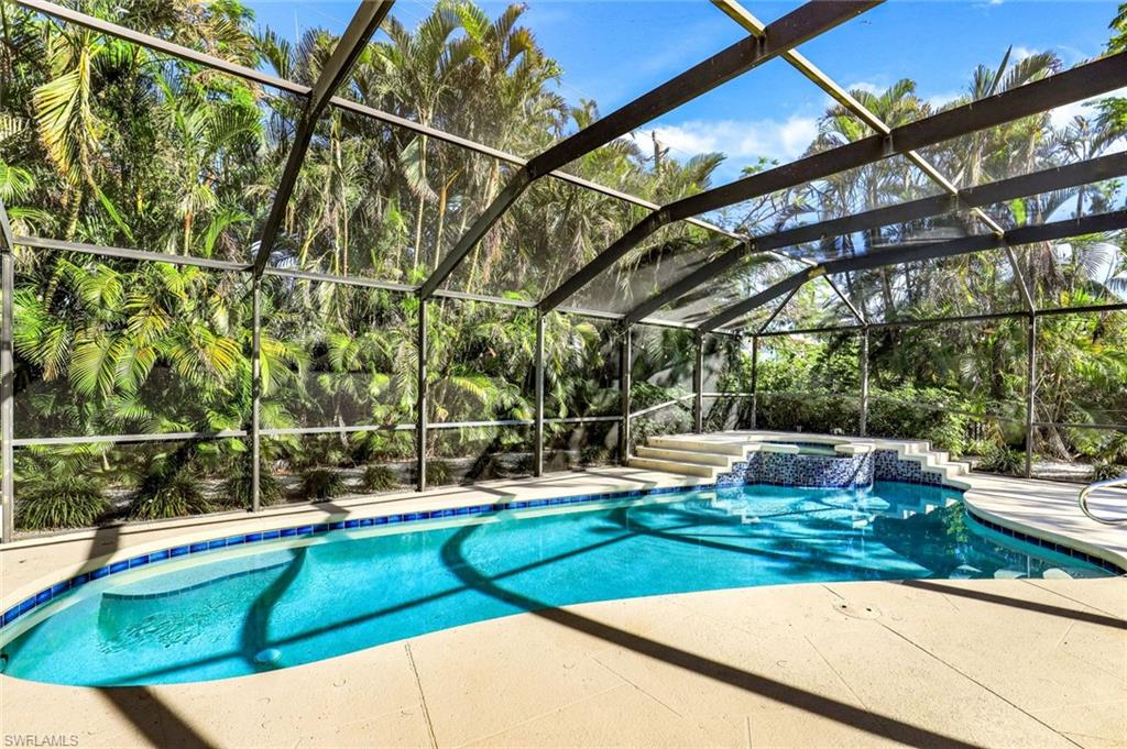 739 7th Avenue North Naples, FL 34102 - Photo 29 of 30 a view of a swimming pool with a patio