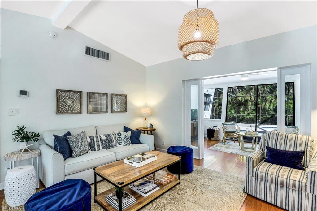 739 7th Avenue North Naples, FL 34102 - Photo 5 of 30 a living room with furniture and a large window