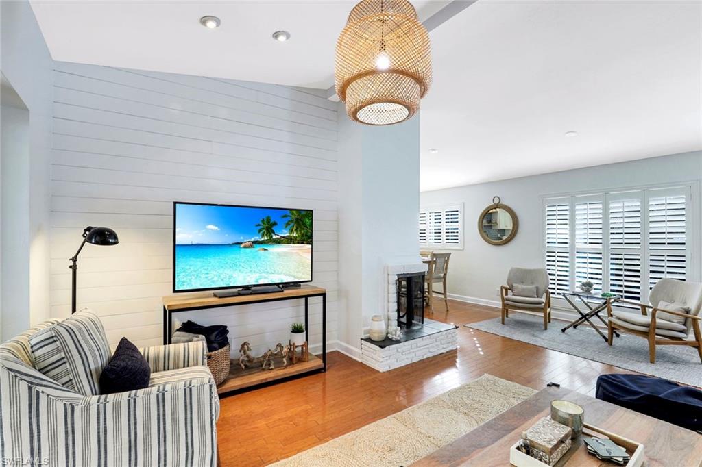 739 7th Avenue North Naples, FL 34102 - Photo 6 of 30 a living room with furniture and a flat screen tv