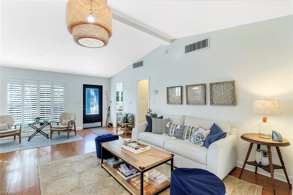 739 7th Avenue North Naples, FL 34102 - Photo 8 of 30 a living room with furniture kitchen view and a window