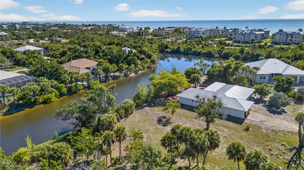 an aerial view of a house with a lake view