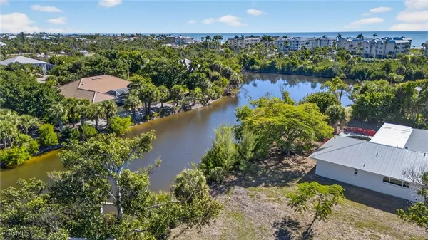 an aerial view of a house with a lake view