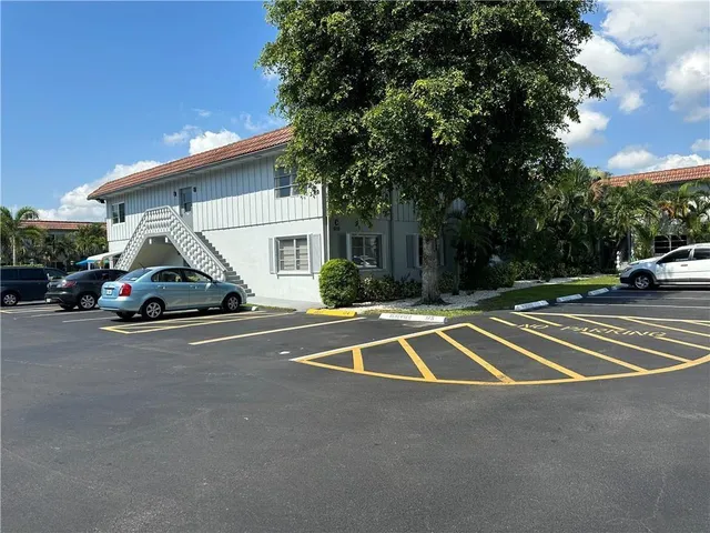 a view of parking and yard