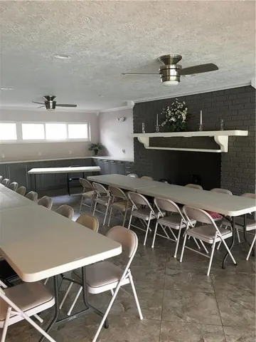 a dinning table sitting next to a window