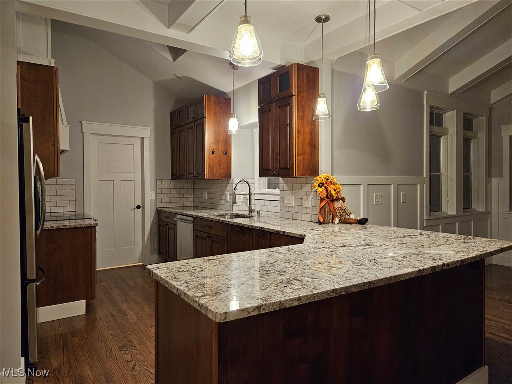 6155 Beach Road Wadsworth, OH 44281 - Photo 15 of 49 Kitchen with decorative tile backsplash, hardwood flooring, pendant lighting, stainless steel appliances, and granite countertops