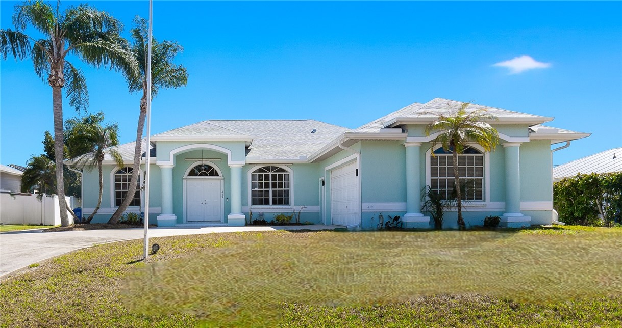 419 Ponoka Street Sebastian, FL 32958 - Photo 1 of 33 a front view of a house with a yard