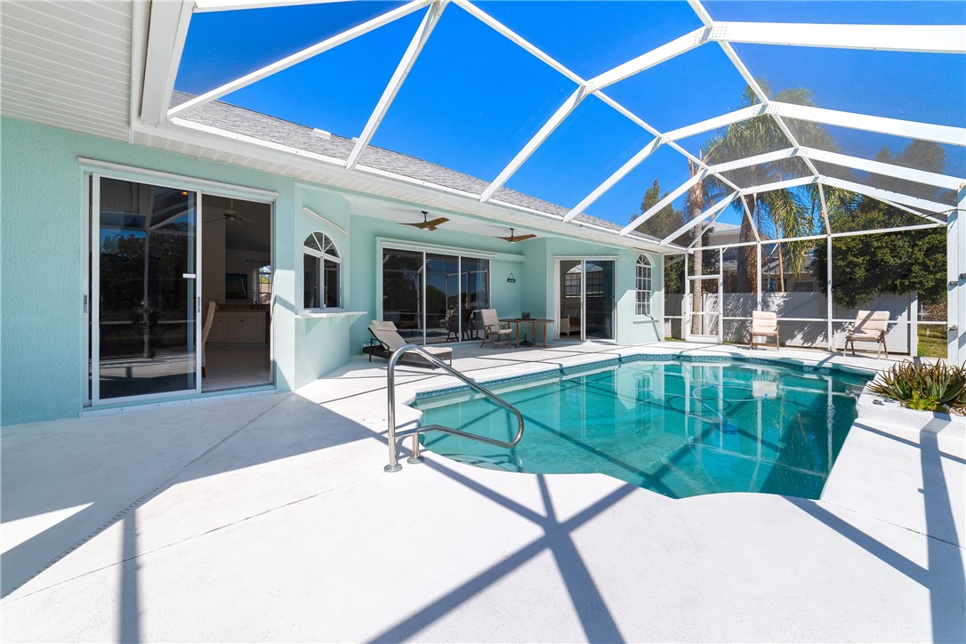 419 Ponoka Street Sebastian, FL 32958 - Photo 12 of 33 a swimming pool with outdoor seating and yard
