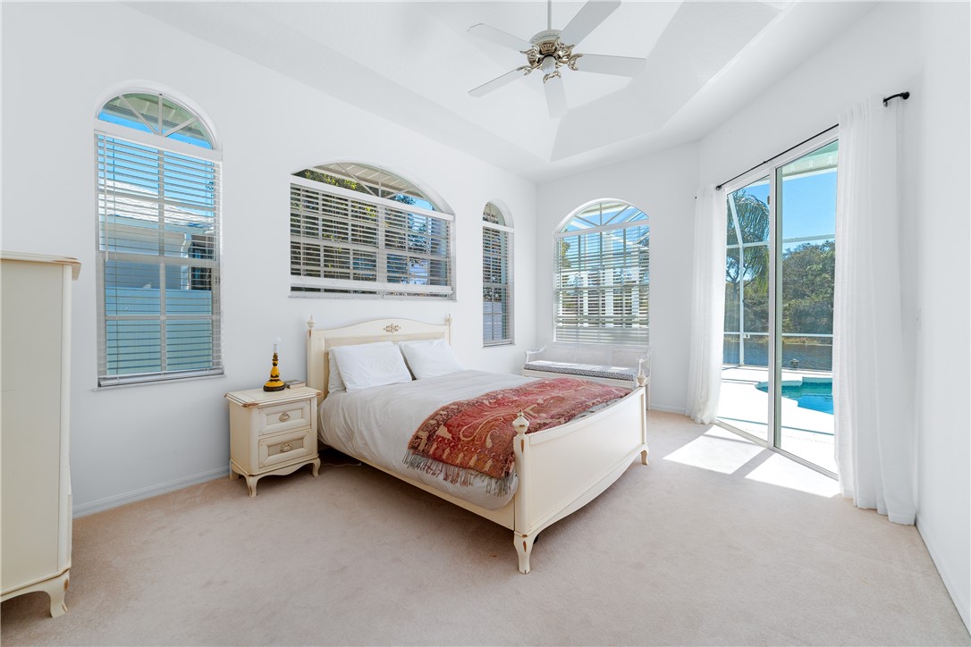 419 Ponoka Street Sebastian, FL 32958 - Photo 13 of 33 a bed sitting in a spacious bedroom next to a window