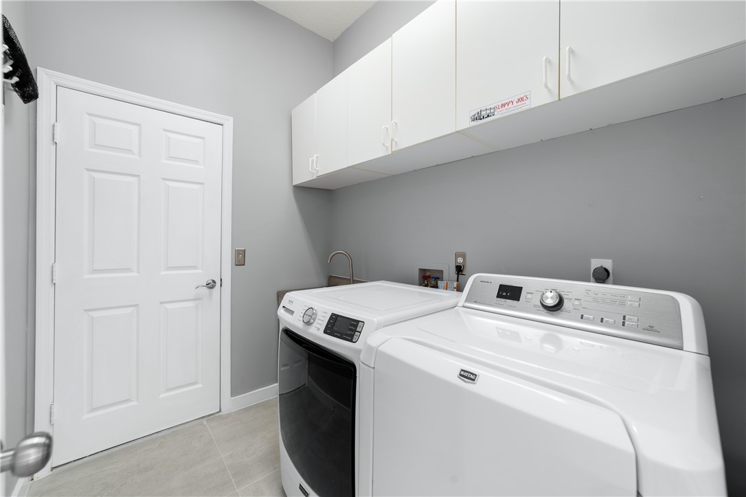 419 Ponoka Street Sebastian, FL 32958 - Photo 22 of 33 a utility room with dryer and washer