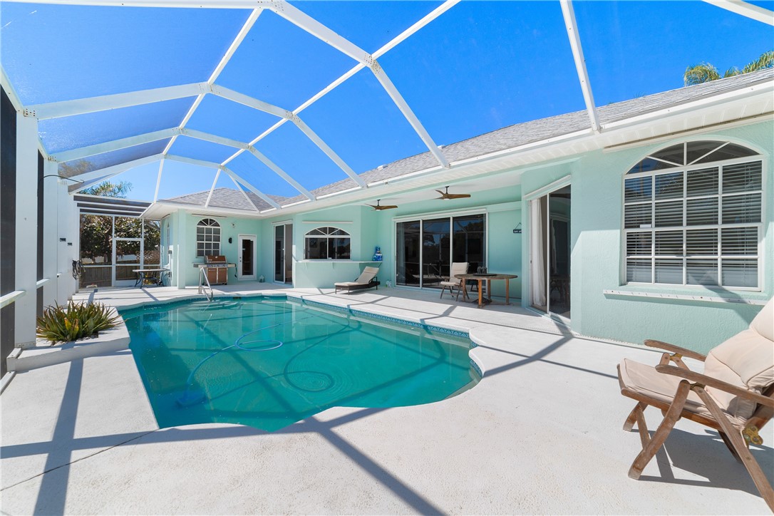 419 Ponoka Street Sebastian, FL 32958 - Photo 23 of 33 a view of a backyard with furniture and tub