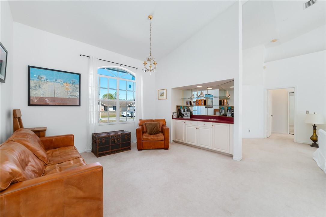 419 Ponoka Street Sebastian, FL 32958 - Photo 6 of 33 a living room with furniture and a chandelier
