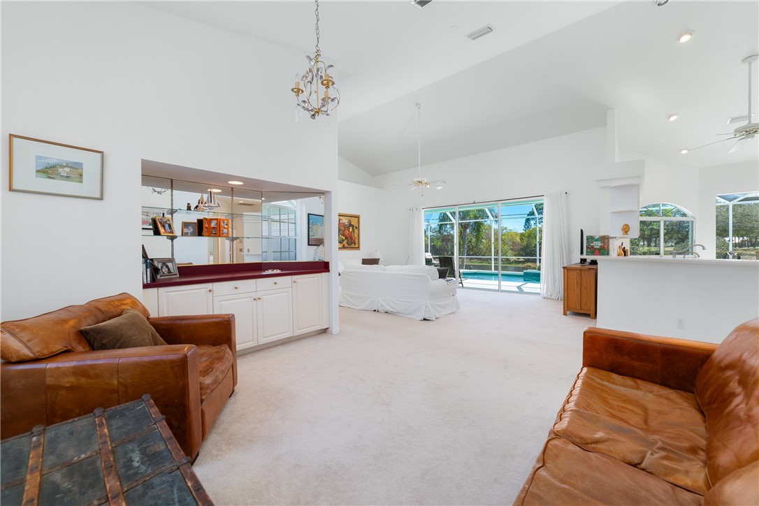 419 Ponoka Street Sebastian, FL 32958 - Photo 7 of 33 a living room with furniture and a chandelier