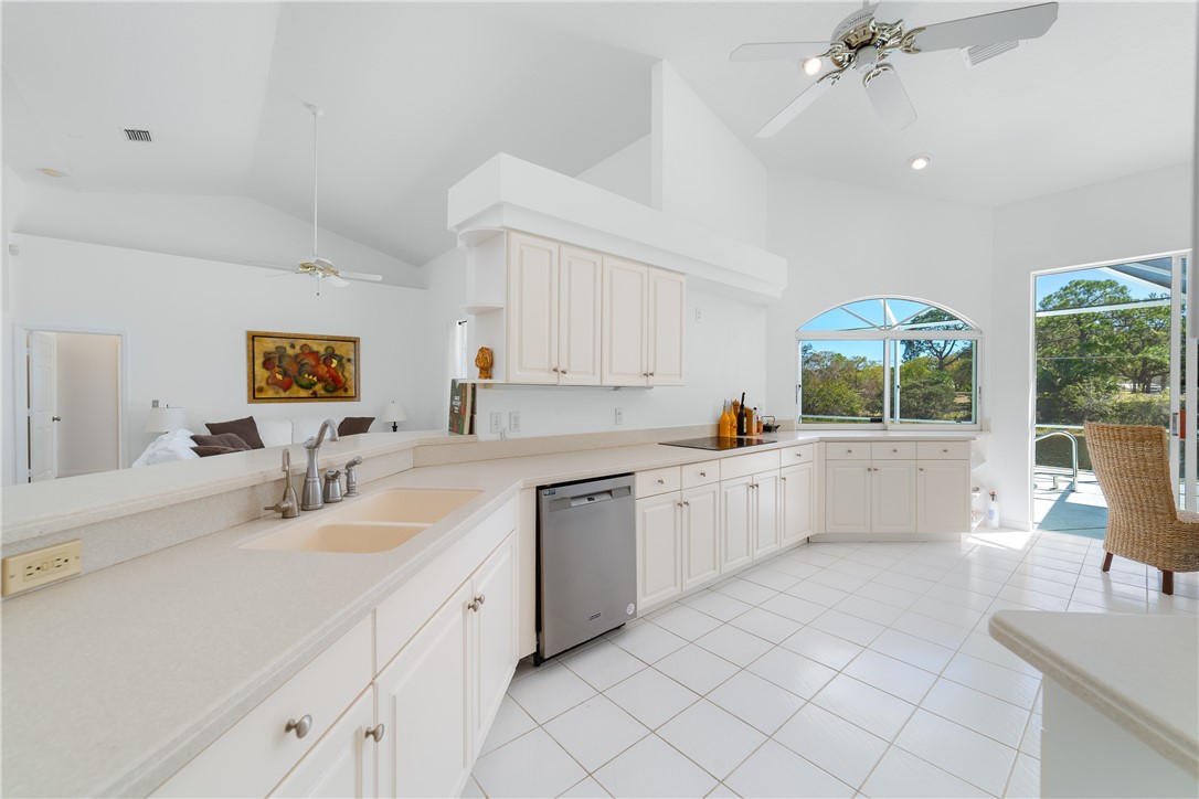 419 Ponoka Street Sebastian, FL 32958 - Photo 9 of 33 a large white kitchen with a window