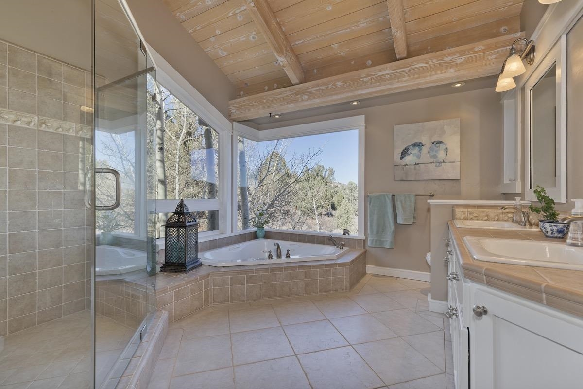 96 Aspen Spring Ranch Road Mammoth Lakes, CA 93546 - Photo 14 of 43 a bathroom with a tub a sink and a shower