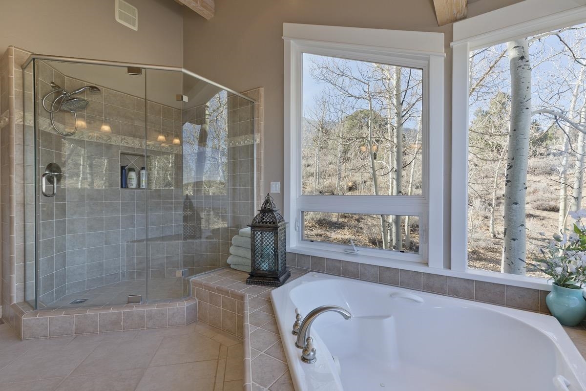 96 Aspen Spring Ranch Road Mammoth Lakes, CA 93546 - Photo 15 of 43 a bathroom with a tub shower and window