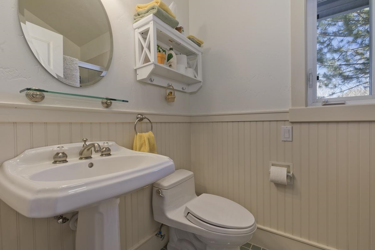 96 Aspen Spring Ranch Road Mammoth Lakes, CA 93546 - Photo 18 of 43 a bathroom with a sink a toilet and mirror