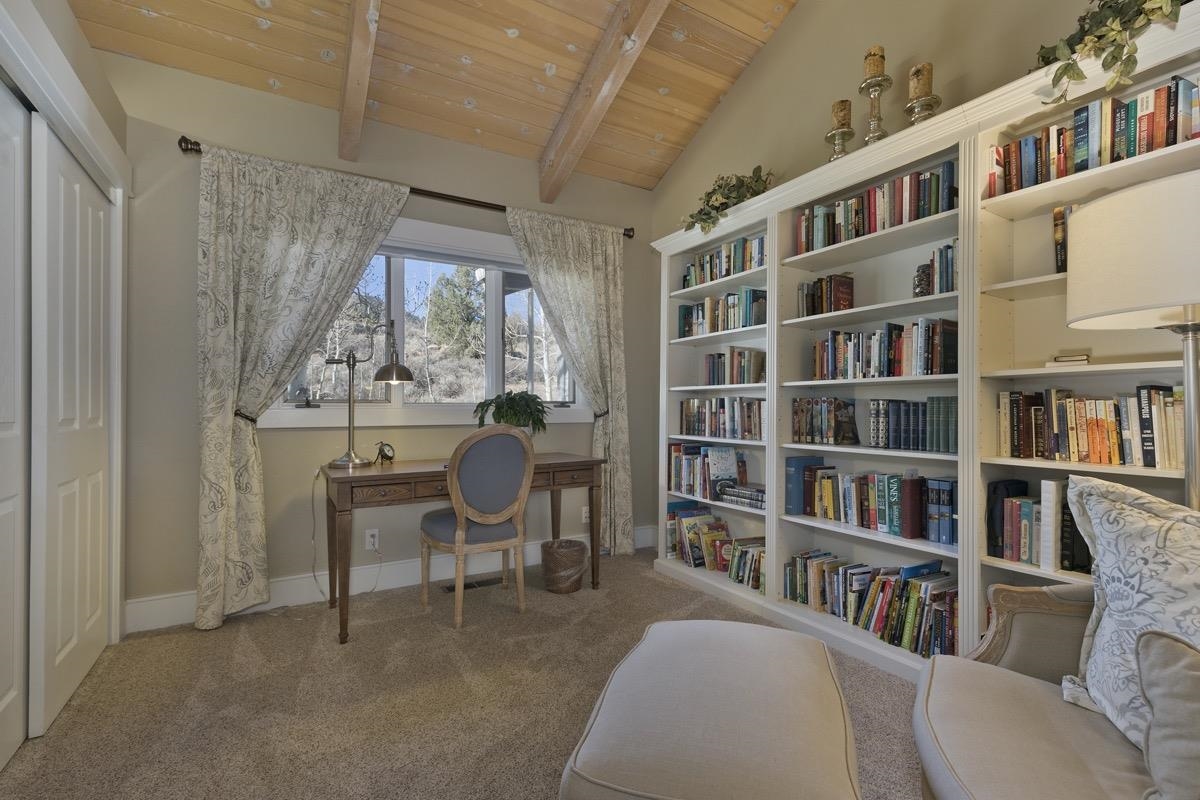 96 Aspen Spring Ranch Road Mammoth Lakes, CA 93546 - Photo 19 of 43 a view of a workspace with furniture and a book shelf