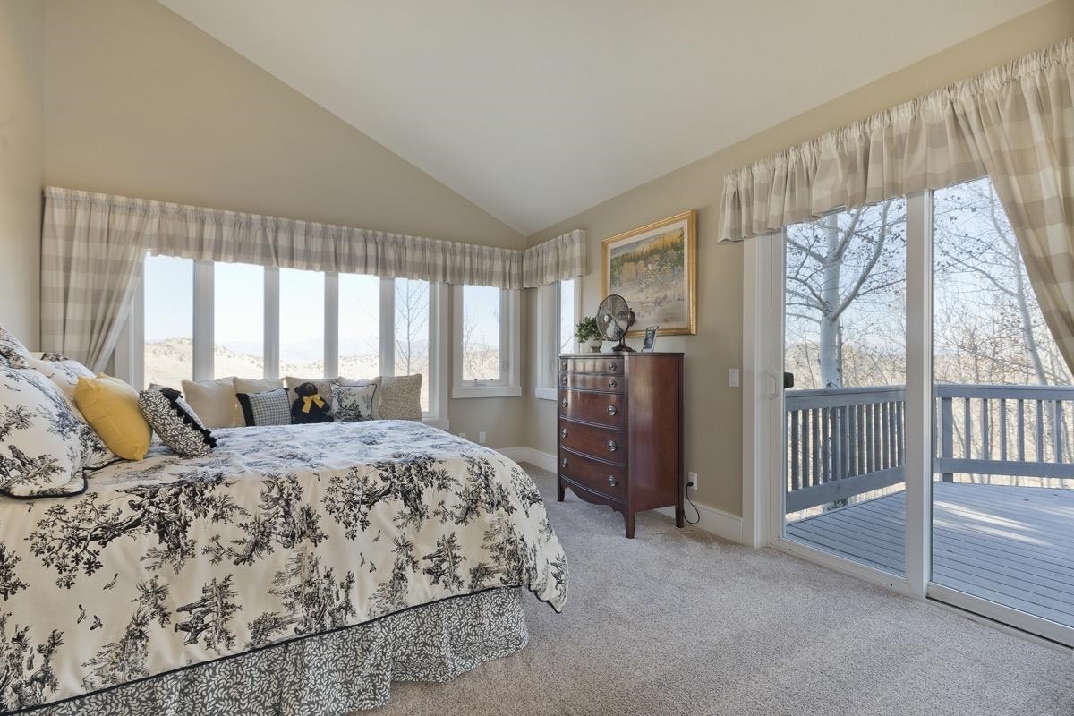 96 Aspen Spring Ranch Road Mammoth Lakes, CA 93546 - Photo 20 of 43 a bedroom with a bed and a dresser next to a window