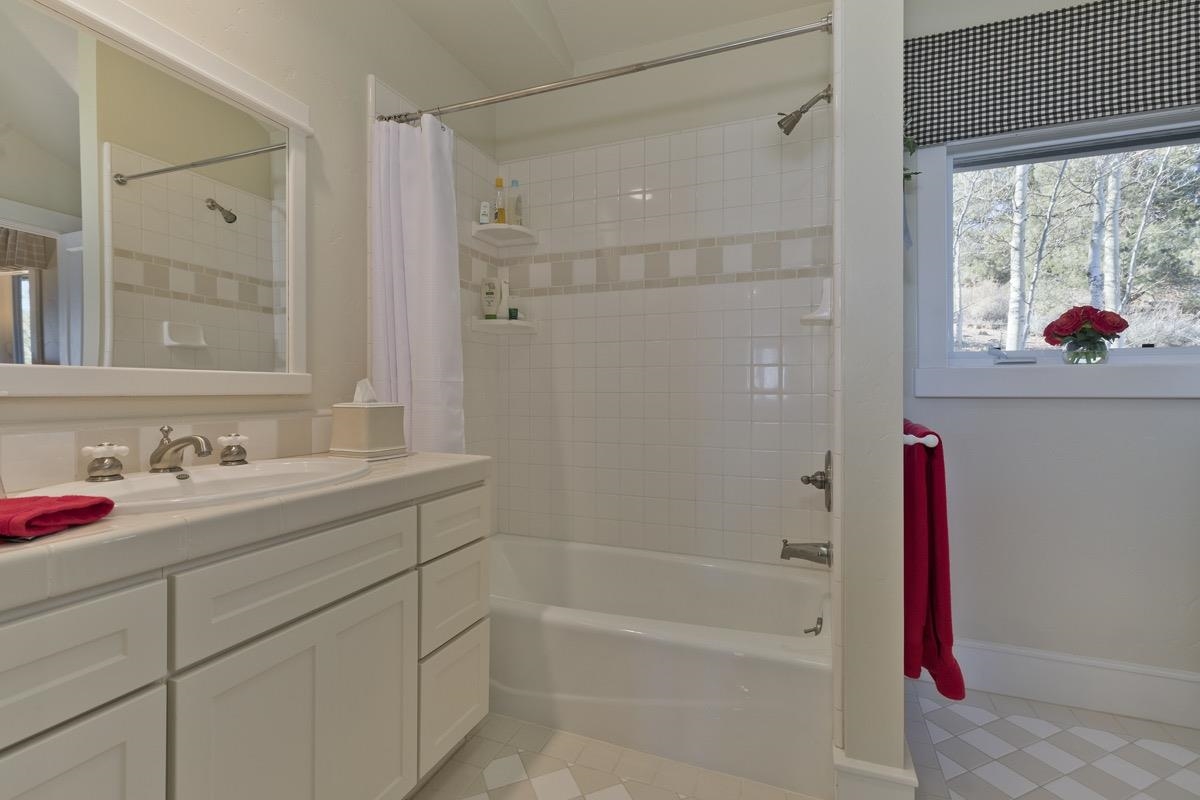 96 Aspen Spring Ranch Road Mammoth Lakes, CA 93546 - Photo 21 of 43 a bathroom with a sink vanity tub and shower