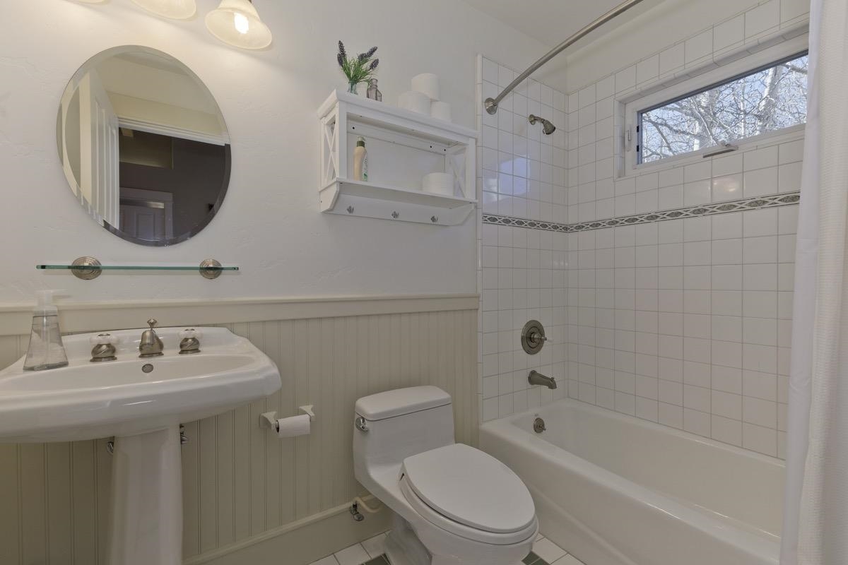 96 Aspen Spring Ranch Road Mammoth Lakes, CA 93546 - Photo 23 of 43 a bathroom with a toilet a sink a mirror and bathtub