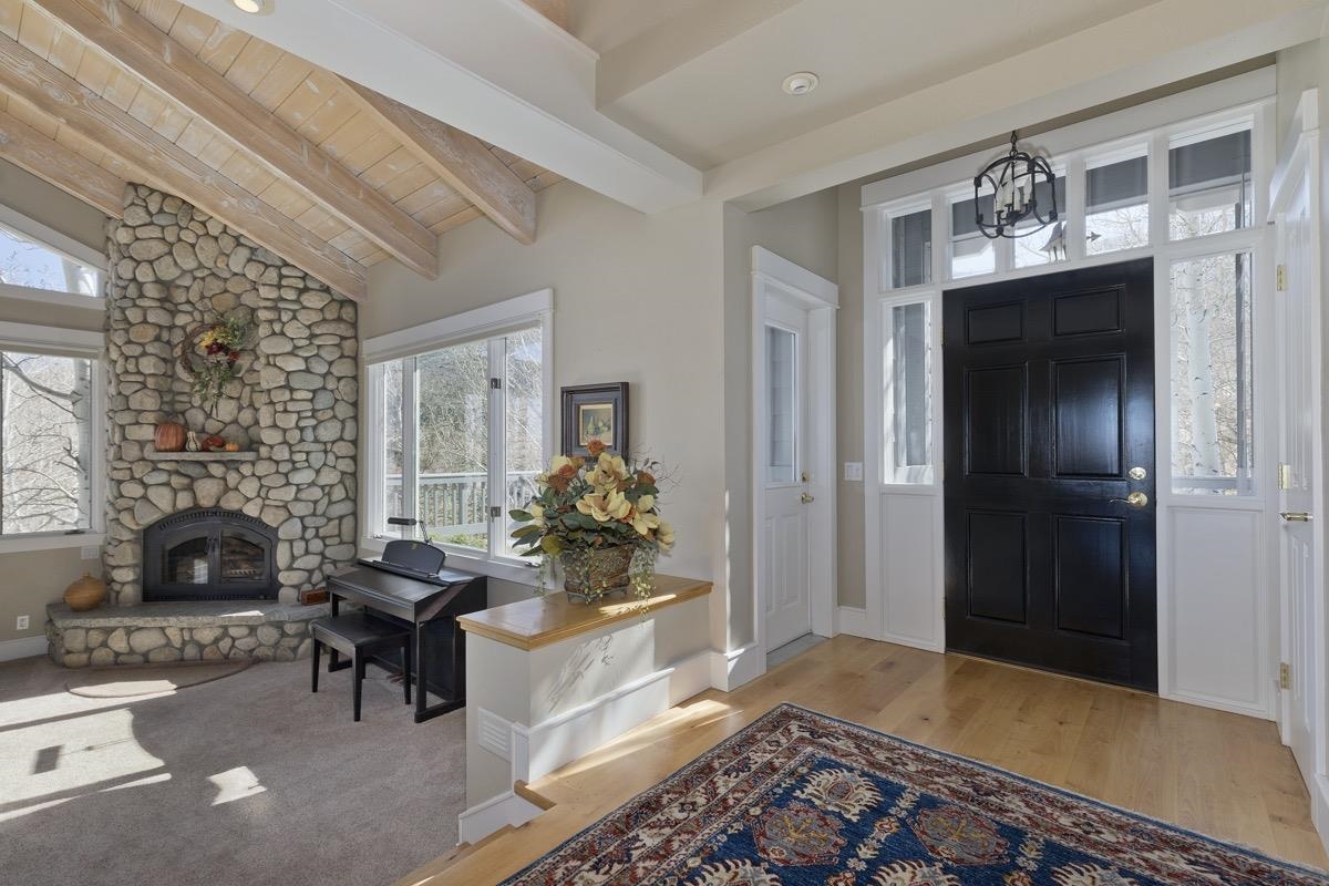 96 Aspen Spring Ranch Road Mammoth Lakes, CA 93546 - Photo 3 of 43 a living room with furniture and a fireplace