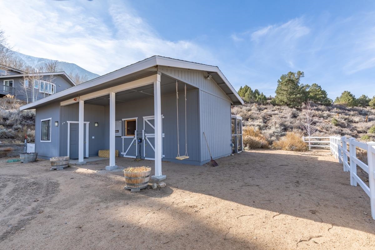 96 Aspen Spring Ranch Road Mammoth Lakes, CA 93546 - Photo 32 of 43 a view of a house with a patio