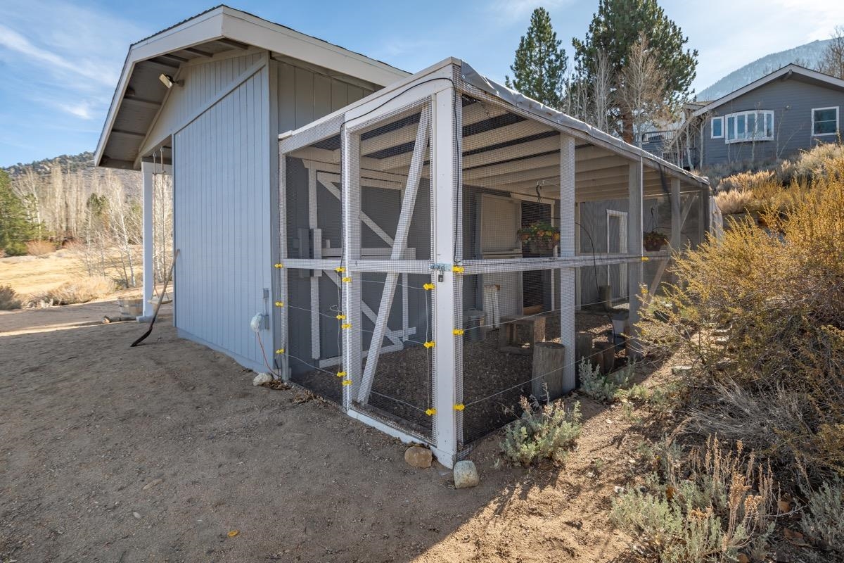 96 Aspen Spring Ranch Road Mammoth Lakes, CA 93546 - Photo 33 of 43 a view of small house with wooden fence