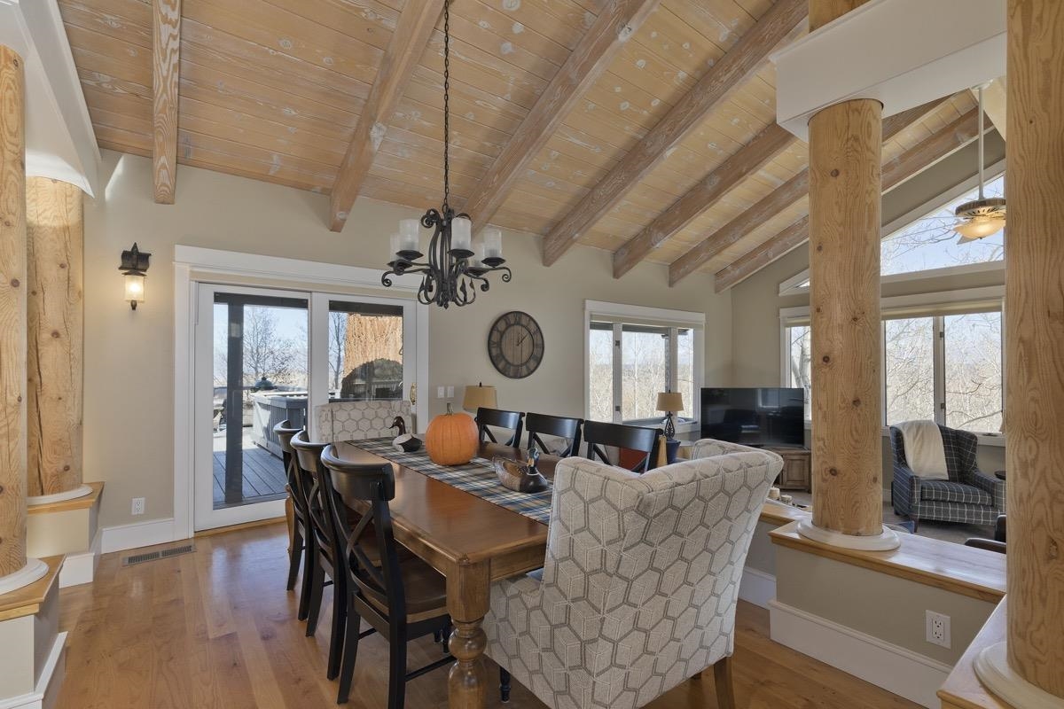 96 Aspen Spring Ranch Road Mammoth Lakes, CA 93546 - Photo 7 of 43 a view of a dining room with furniture window and wooden floor
