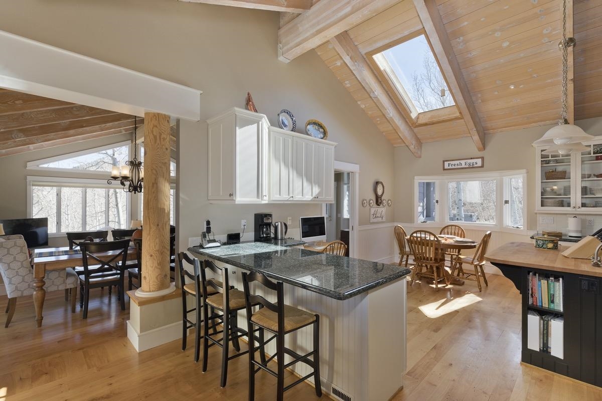 96 Aspen Spring Ranch Road Mammoth Lakes, CA 93546 - Photo 8 of 43 a view of a dining room with furniture and wooden floor