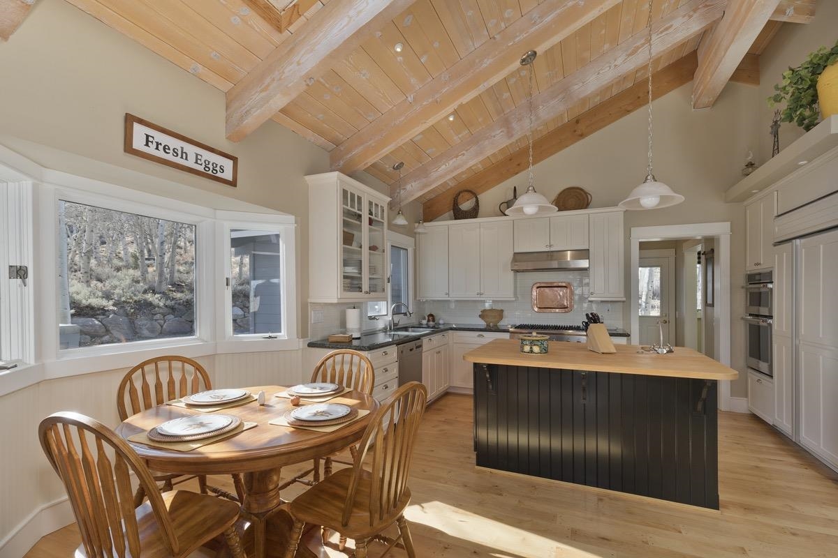 96 Aspen Spring Ranch Road Mammoth Lakes, CA 93546 - Photo 9 of 43 a living room with granite countertop furniture a dining table and chairs