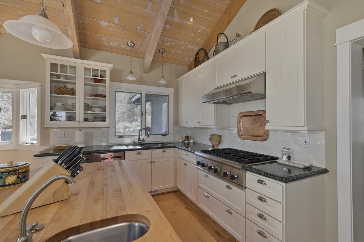 96 Aspen Spring Ranch Road Mammoth Lakes, CA 93546 - Photo 10 of 43 a kitchen with granite countertop a stove and a sink