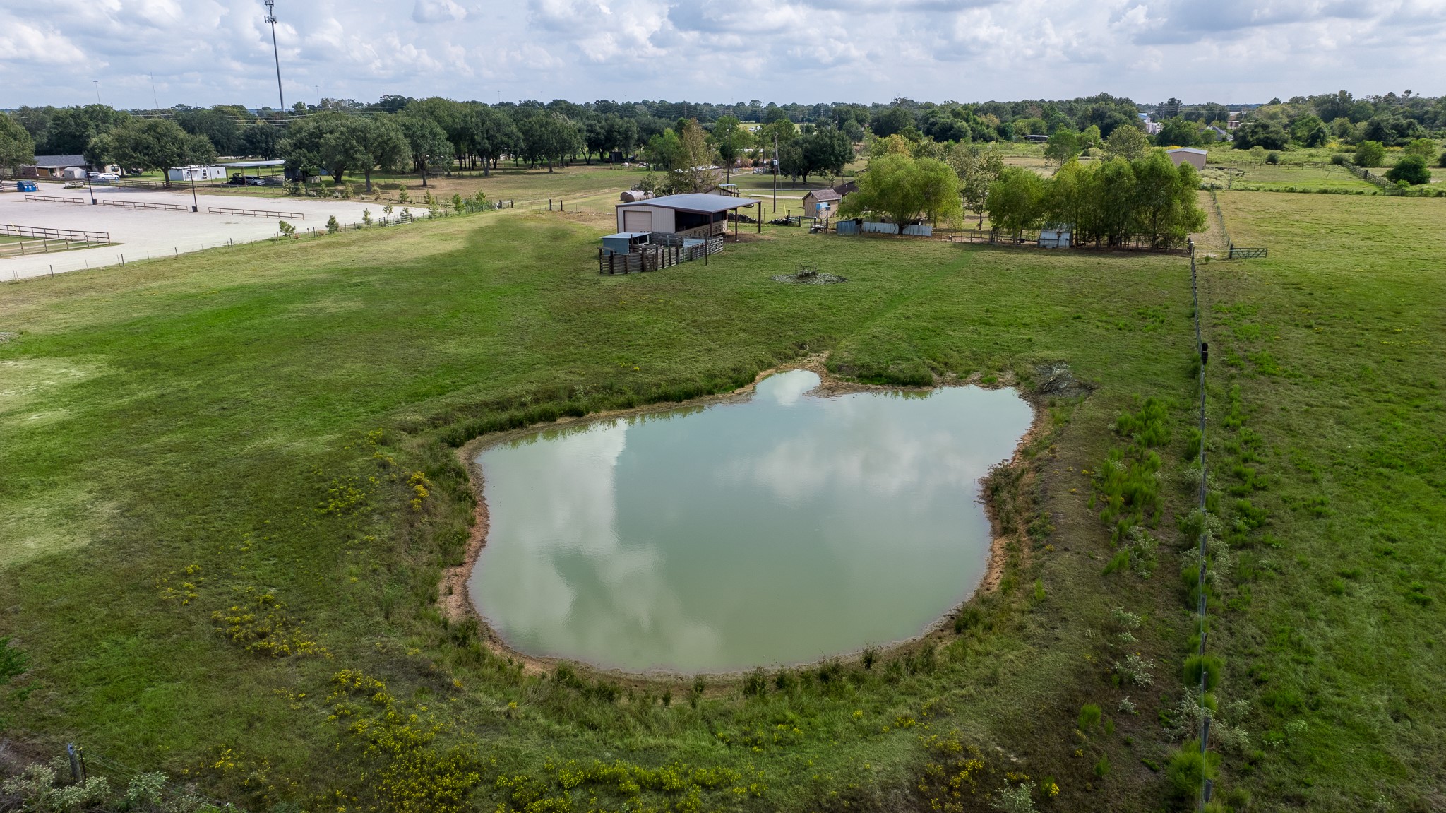 19105 Mueschke Road Tomball, TX 77377 - Photo 9 of 42 Private pond adds character to the property and may offer potential use for irrigation, retention, or future site planning. Buyer to verify feasibility.