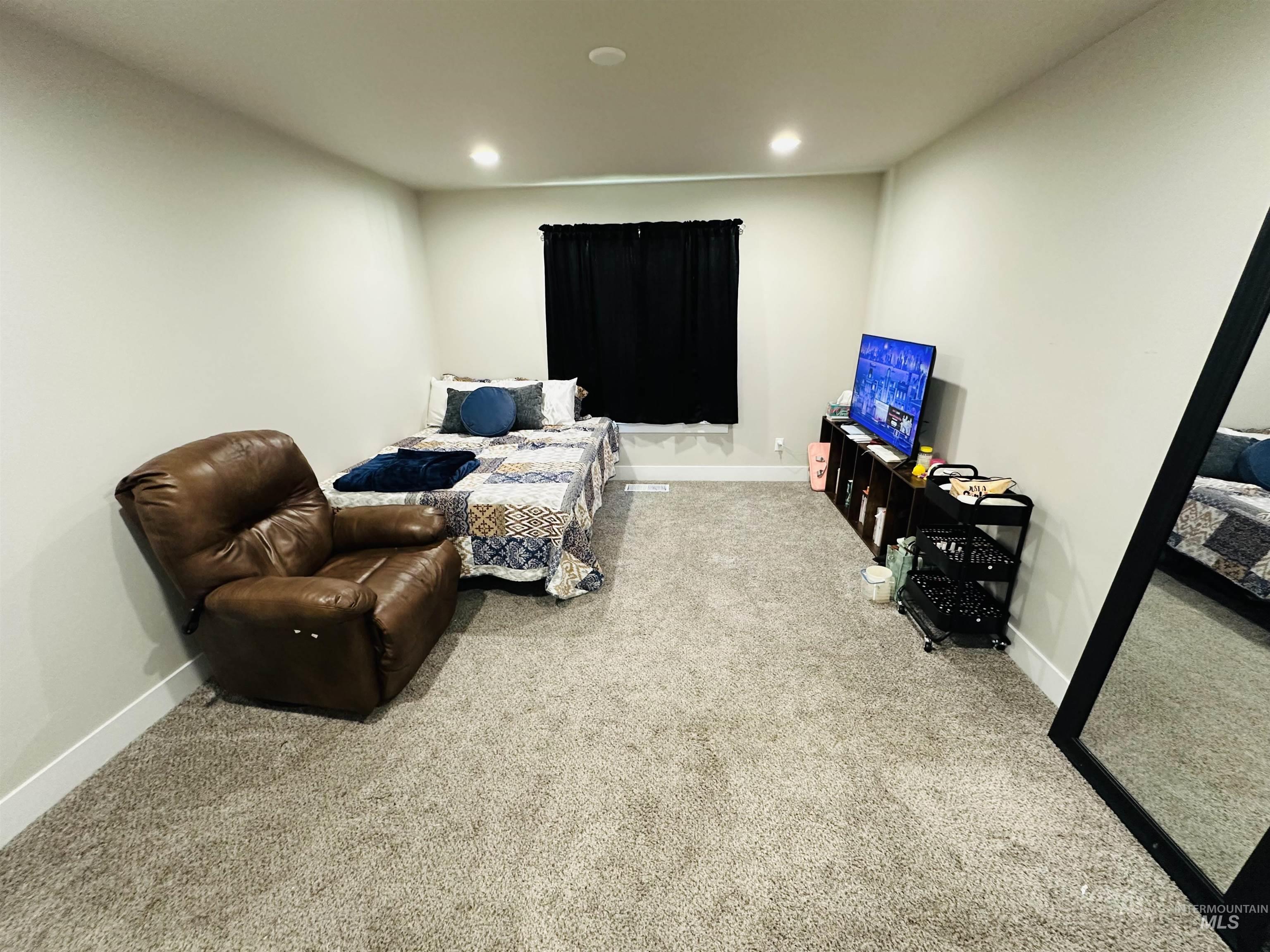 911 Campbell Street Vale, OR 97918 - Photo 11 of 37 Carpeted living area featuring recessed lighting