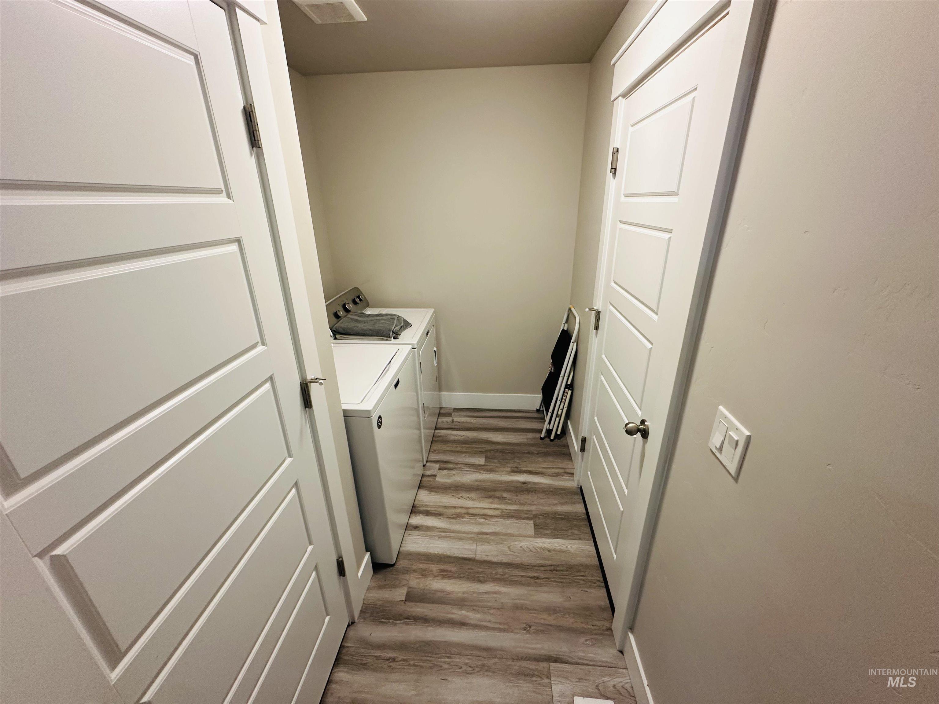 911 Campbell Street Vale, OR 97918 - Photo 22 of 37 Laundry area featuring washer and dryer and light wood-type flooring
