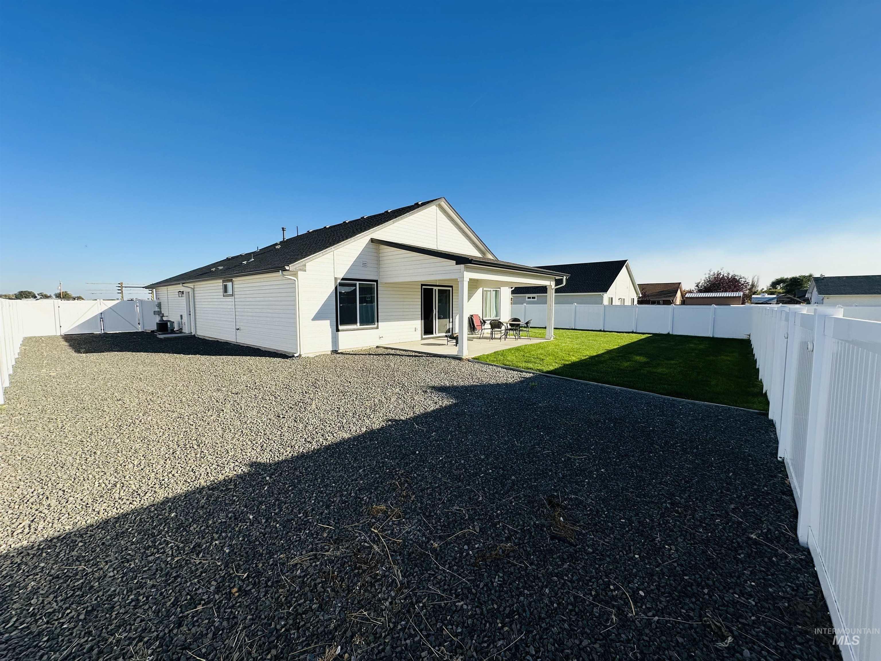 911 Campbell Street Vale, OR 97918 - Photo 32 of 37 Back of house featuring a fenced backyard and a patio