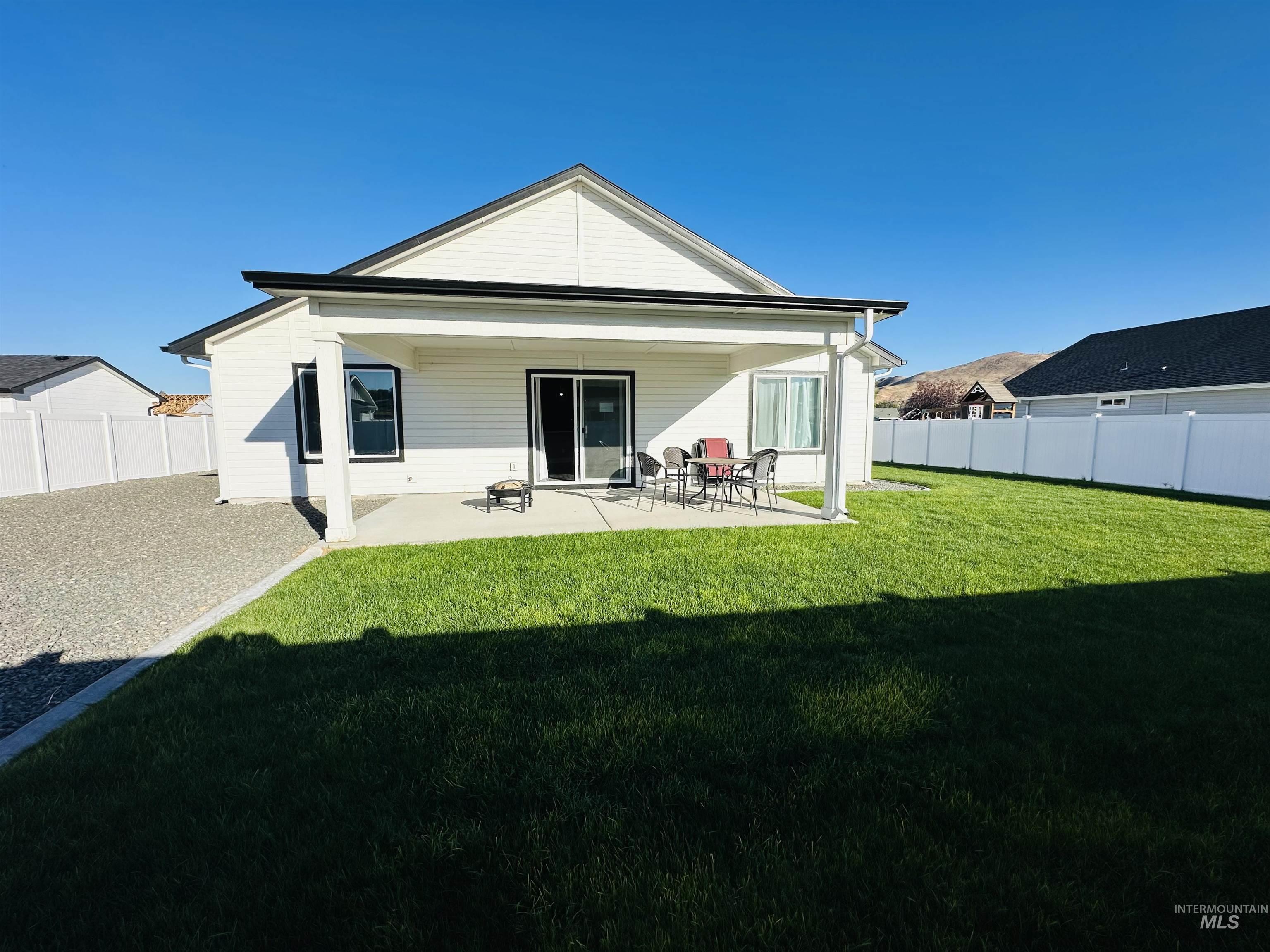 911 Campbell Street Vale, OR 97918 - Photo 35 of 37 Rear view of property with a fenced backyard and a patio