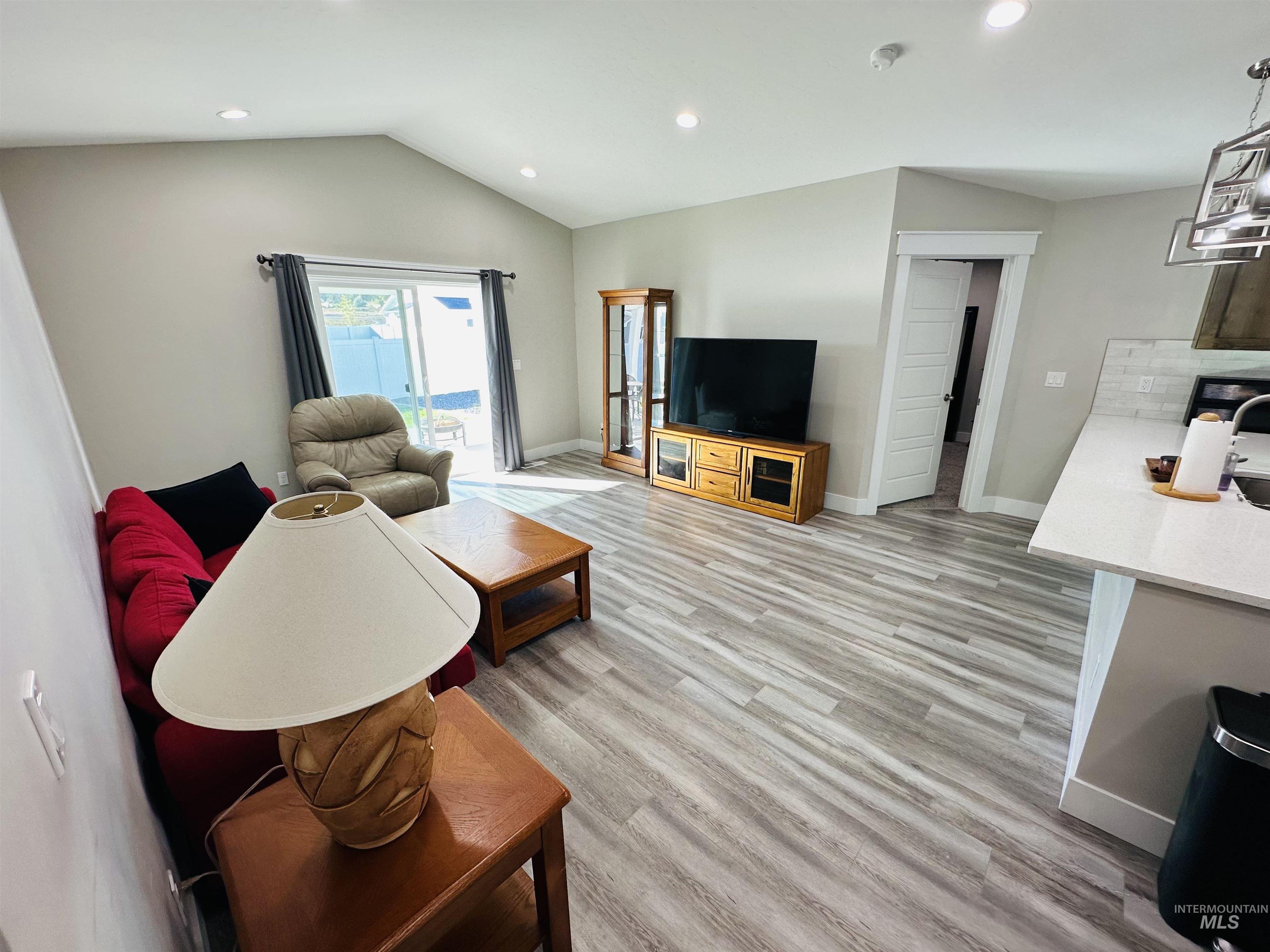 911 Campbell Street Vale, OR 97918 - Photo 8 of 37 Living room with recessed lighting, lofted ceiling, and light wood-style floors