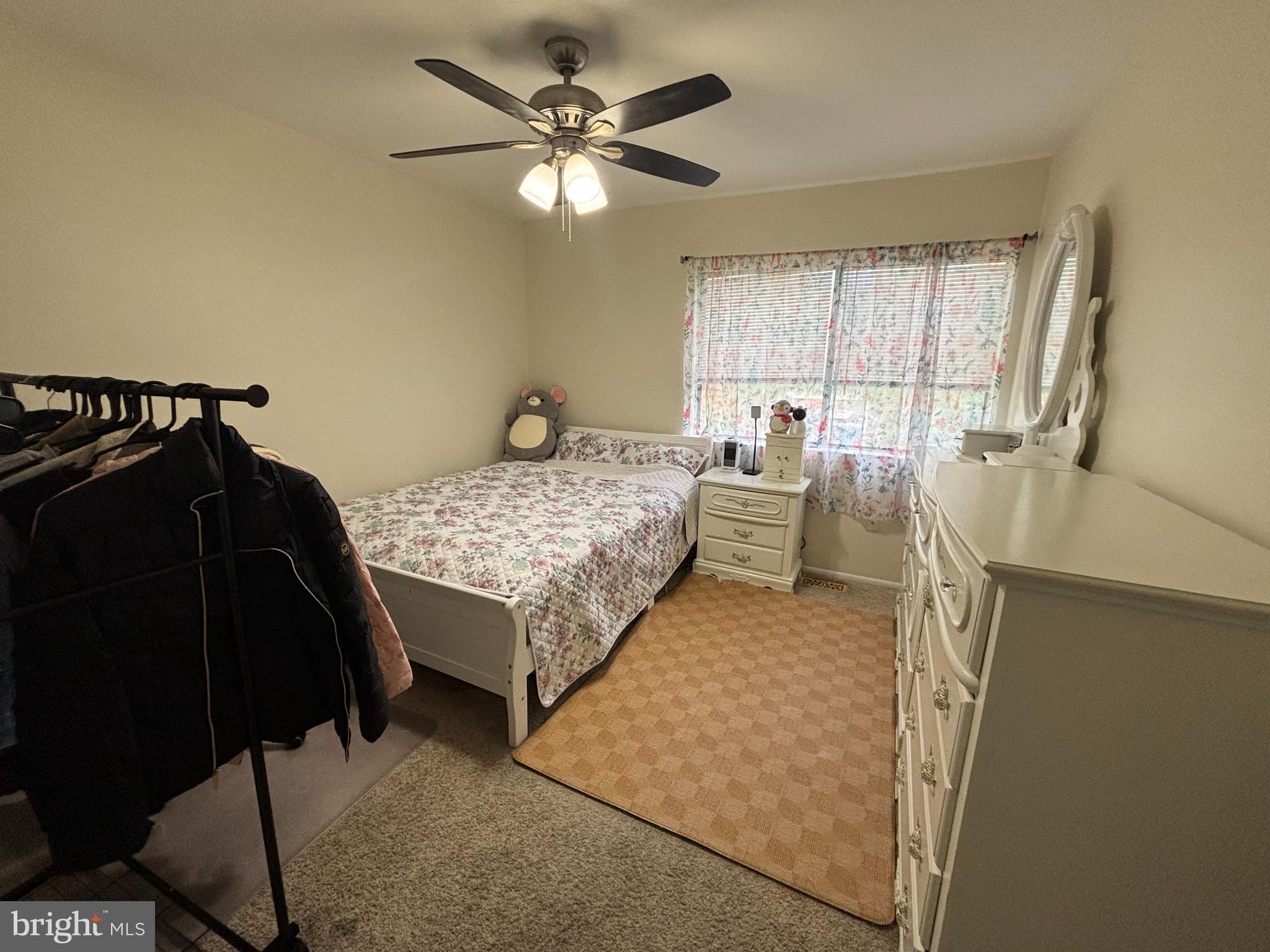 35 Harwood Lane Clementon, NJ 08021 - Photo 18 of 24 a bedroom with a bed and a chandelier