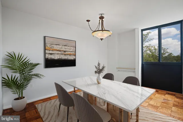 a view of a dining room with furniture window and wooden floor