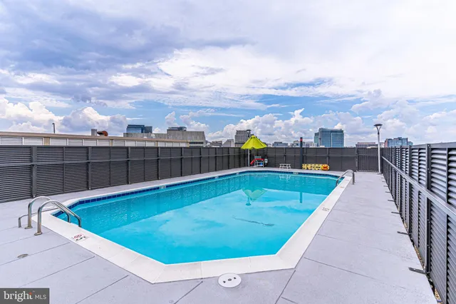 a view of a terrace with furniture and a stove