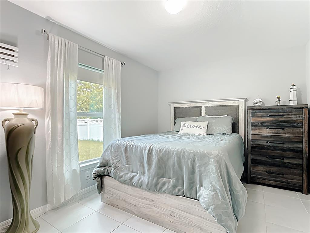 2713 Embassy Road North Port, FL 34291 - Photo 12 of 30 a bedroom with a bed and a window