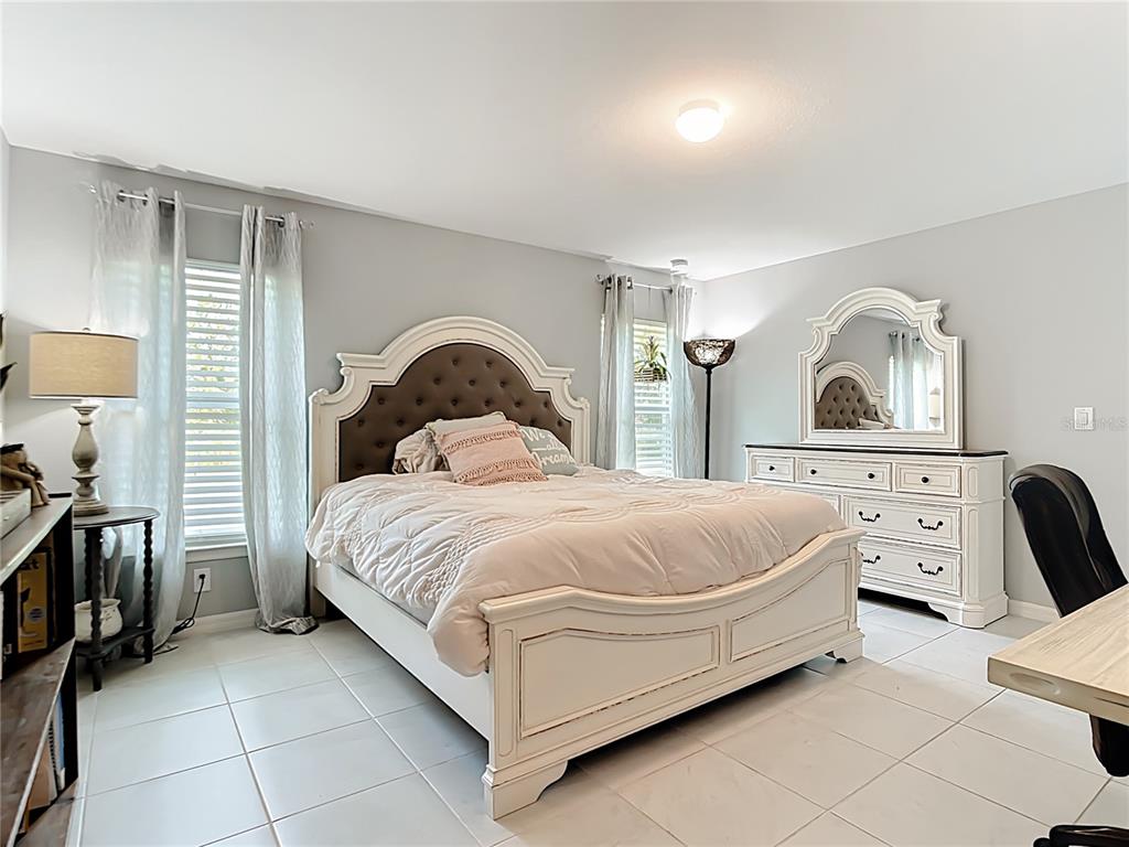 2713 Embassy Road North Port, FL 34291 - Photo 13 of 30 a bed room with a bed and a dresser