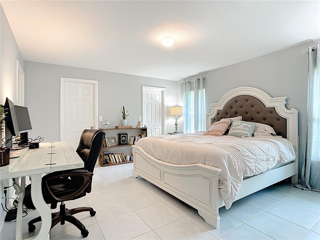 2713 Embassy Road North Port, FL 34291 - Photo 14 of 30 a bedroom with a bed chair and a desk