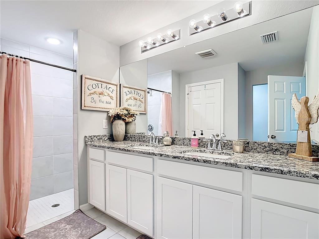2713 Embassy Road North Port, FL 34291 - Photo 15 of 30 a bathroom with a sink and a mirror