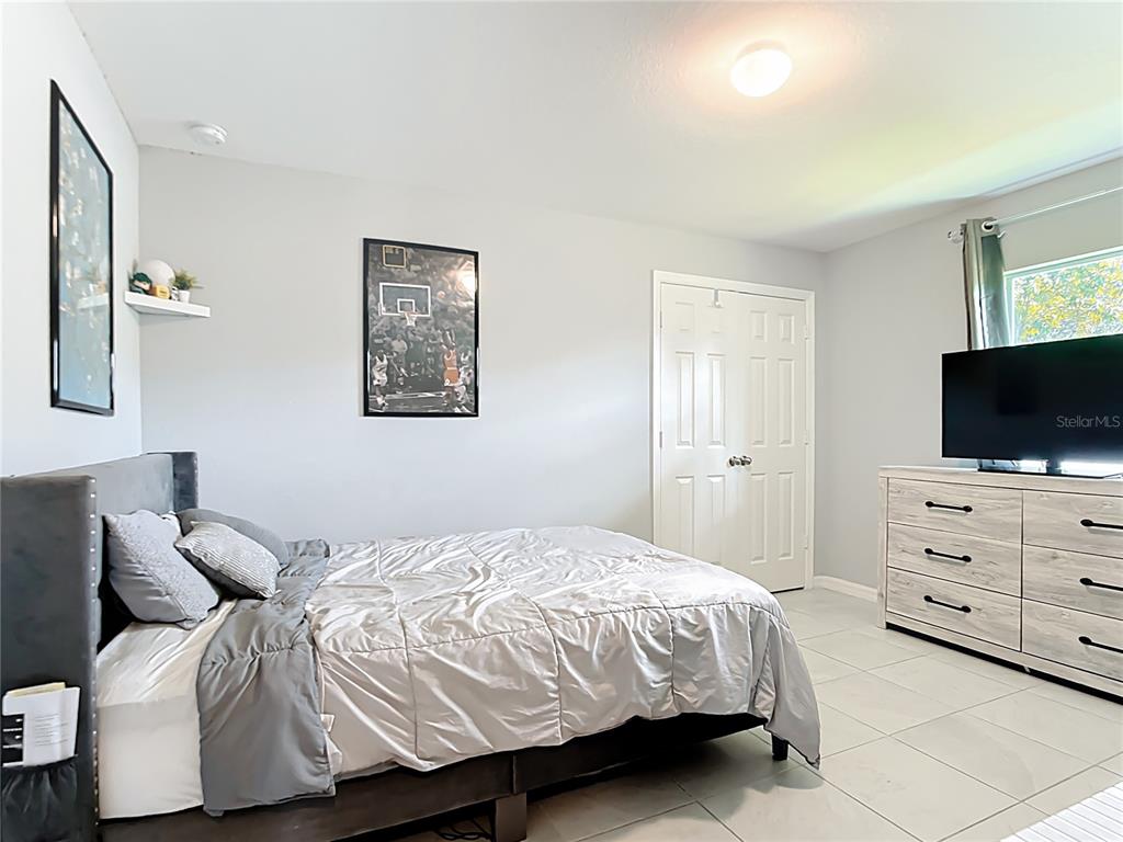 2713 Embassy Road North Port, FL 34291 - Photo 17 of 30 a bedroom with a bed and furniture